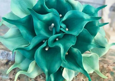 Unique floral arrangements with teal flowers, ideal for weddings, corporate events, and social gatherings in Orange County.