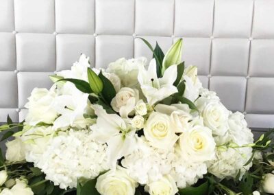 Modern floral arrangement with white roses and lilies, ideal for wedding flowers in Orange County or corporate and social events.